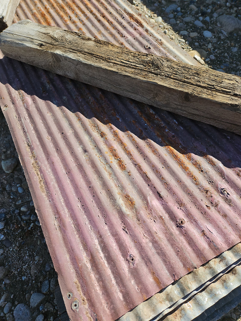 Small corrugated old roofing tin with coatings & paint in variety of colors