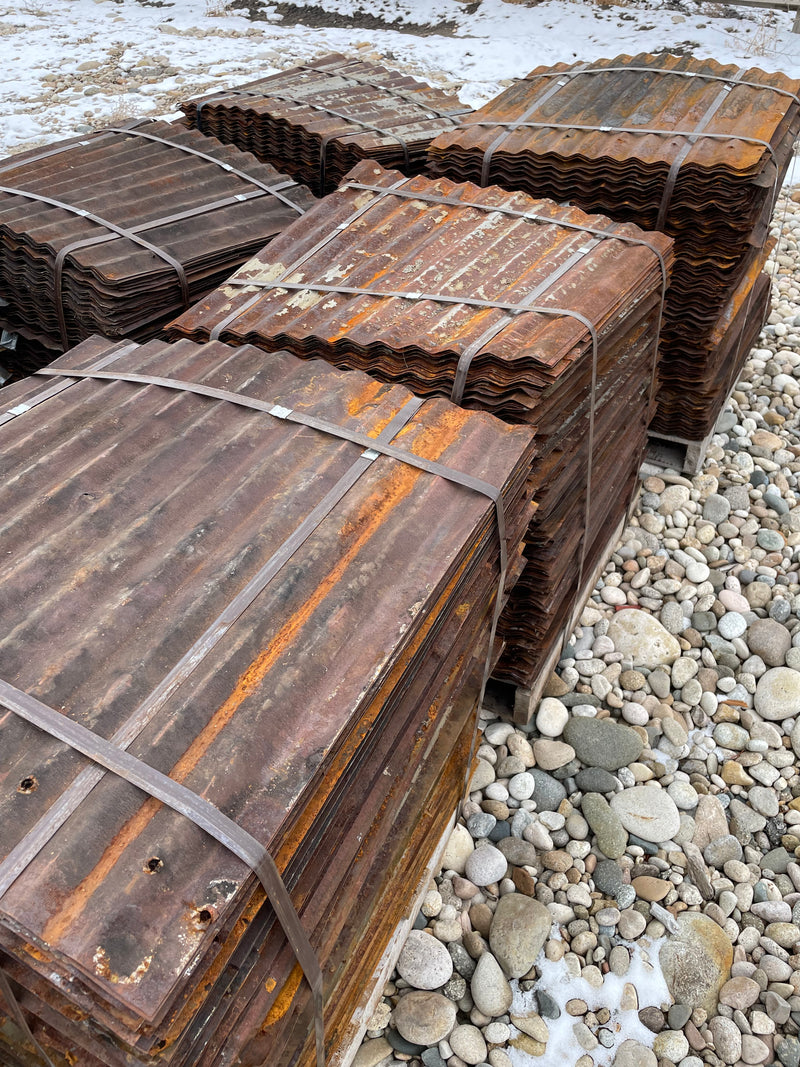 bundles of salvaged corrugated metal roofing